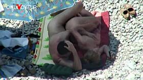 Beach voyeur catches mature couple banging under bright sun