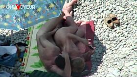 Beach voyeur catches mature couple banging under bright sun