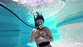 Brita piskova masturbates her tight pussy underwater in the pool