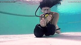 Brita piskova masturbates her tight pussy underwater in the pool