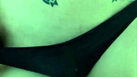 Inked crossdresser performing solo on webcam