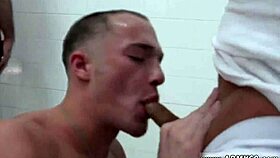 naked gay soldier gets hazed in the shower, his penis exposed.