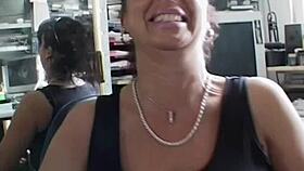 This mature brunette slut is getting fucked at work with big tits and handjob