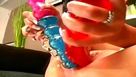 Woman gets her pussy stretched by huge toys.