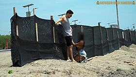 brown girl with big fake boobs kneels at beach before hardcore pounding