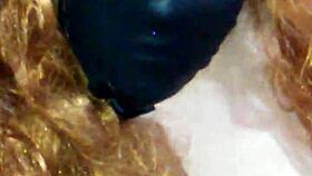 face mask on, black dildo in mouth