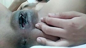 Solo babe masturbates shaved pussy to orgasm in close up detail.