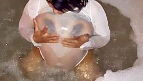 latina girl gets wet using vibrator on ass and tits