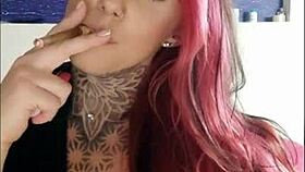 Steamy smoking fetish babe with natural tits and a sexy tattoo