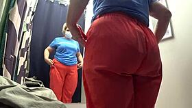 I caught a curvy milf in the fitting room with big ass in white panties.