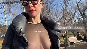 Wow, this beauty flashes her big boobs while walking in a public park!