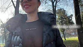Wow, this beauty flashes her big boobs while walking in a public park!