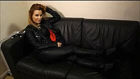 The rock chick poses in leather pants and biker jacket.