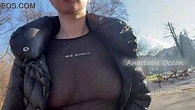 Wow, this beauty flashes her big boobs while walking in a public park!