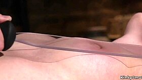 Blindfolded brunette sub bound and caned in rough maledom play.