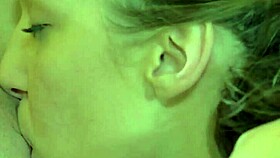 More mature lesbian in black stockings grips partner's hair during intense pussy eating session