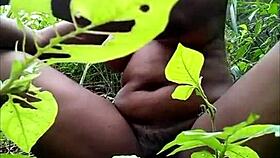 Why is that tribal african fingering herself in the woods?