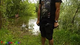 Watch this gay guy jerking off by the lake while fingering his tight hole