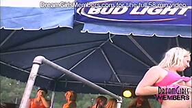 Women undress in a wet t-shirt contest at a biker rally