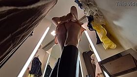Can you spot the hidden camera in the dressing room as she tries on sexy clothes?