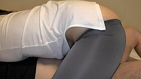 A beautiful Japanese woman gives her husband a deep kiss while riding him in a hot cowgirl scene