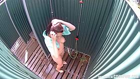 brunette milf relaxes in a public pool shower