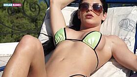 Oiled brunette lesbians rub their wet asses