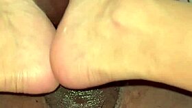 Giving a foot job to a black man with a big dick
