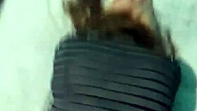 In a homemade webcam setup, a Latina emo milf shares a POV moment on a big bed using a notebook for connection.