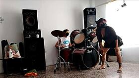 She strips and dances, showing her curvy ass for their drum beats.