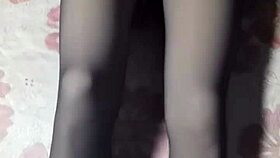 asian crossdresser strokes hard in black pantyhose and jeans.