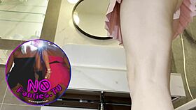 Skinny brunette shows assets in pink mini skirt