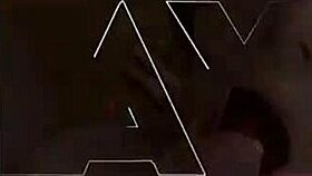 Amoul in satin dress and thong with stockings and heels performs a solo scene.