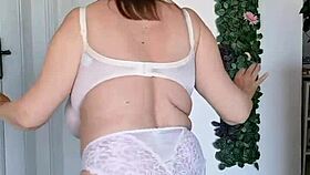 Hey, can you believe this busty granny dancing in sexy lingerie? How does she rock those stockings?