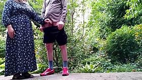 Sweet stepmom aids stepson with peeing outdoors in unique moment