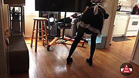 A hot French maid cleans the house with a vacuum cleaner