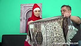 arab woman kneels on the new rug, giving a great blowjob to her partner.