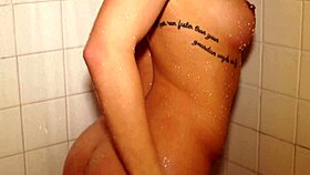 She fucks herself in the shower with a dildo