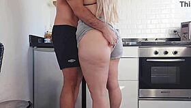 This blonde milf gets interrupted while cooking for a quick kitchen fuck with her stepson