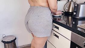 This blonde milf gets interrupted while cooking for a quick kitchen fuck with her stepson