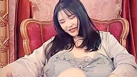 asian milf in blue satin on webcam