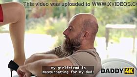 Man, this slutty gf is sucking cock and stripteasing for another right in the same room!