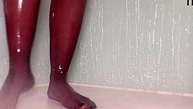 Teasing nylon feet in the wet shower, stockings on toes.