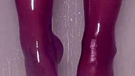 Teasing nylon feet in the wet shower, stockings on toes.