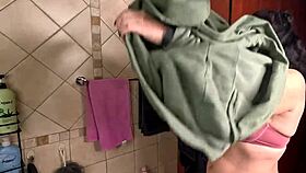 sexy woman RUBBING some OIL on her BODY