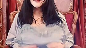 asian milf in blue satin on webcam