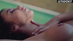 Passionate teenage girls kissing by the pool