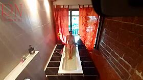 peep voyeur catches fat housewife undressing, stripping in the shower, washing with soap, shaving her pussy in the bath.