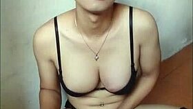 This amateur shemale in black bra and stockings is cumming on a handkerchief.