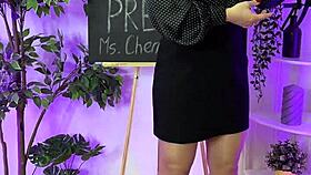 Oh wow, sexy milf in heels and glasses putting on leather harness! Domination time!